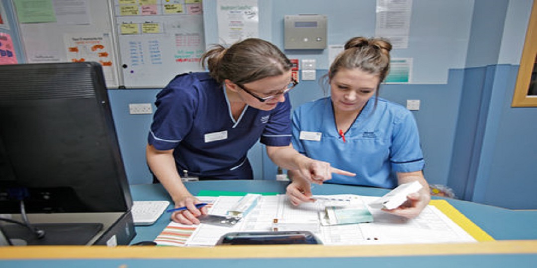 Hospital staff at a desk