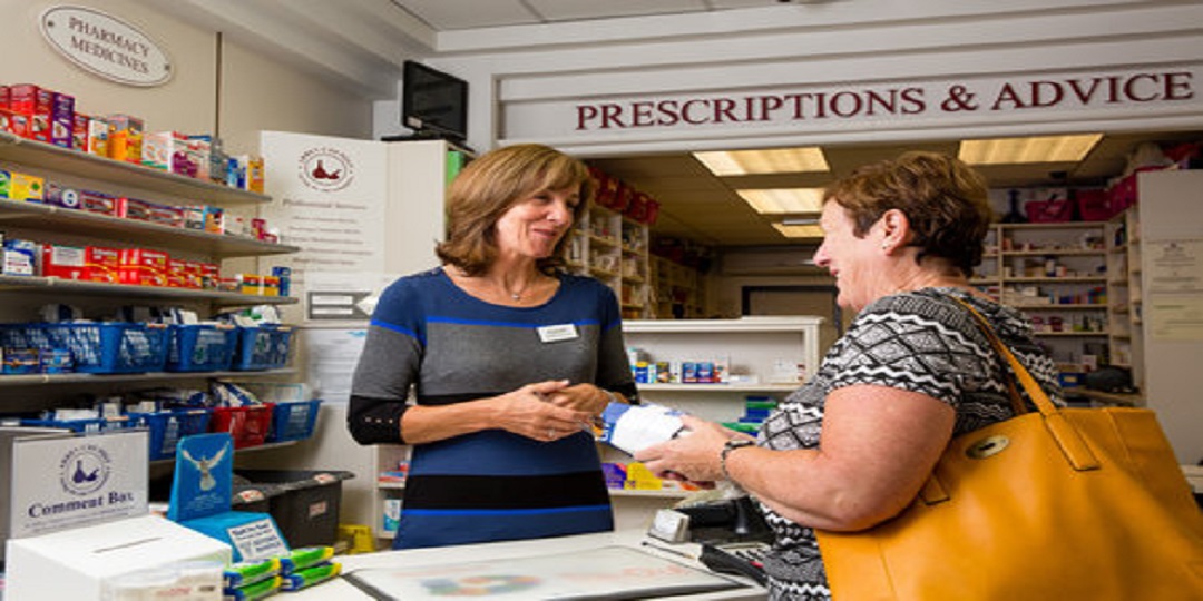 a person talking to a pharmacist