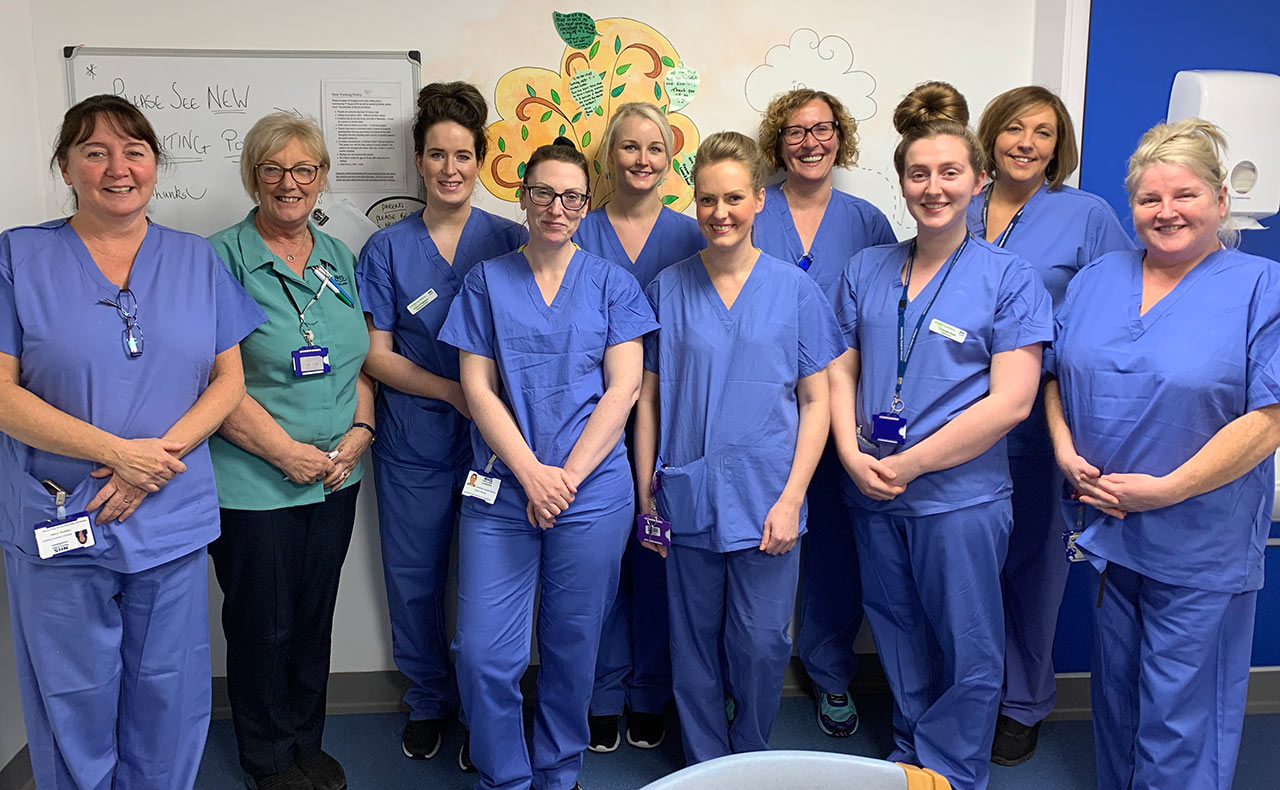 Neonatal Team standing in blue tunic