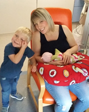 women sitting on chair next to a boy