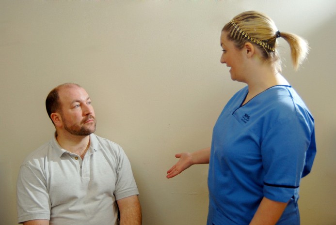 nurse talking to patient