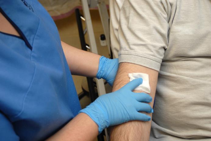 nurse applying a small bandage