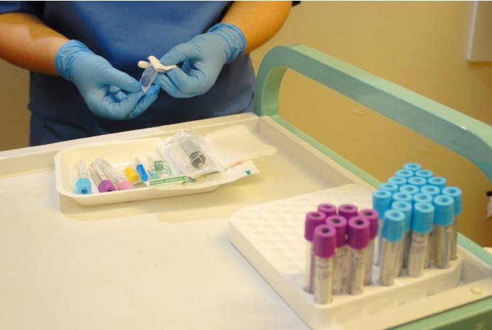 nurse prepping needles