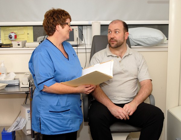 a person talking to a nurse