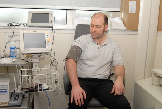 a person getting their blood pressure taken