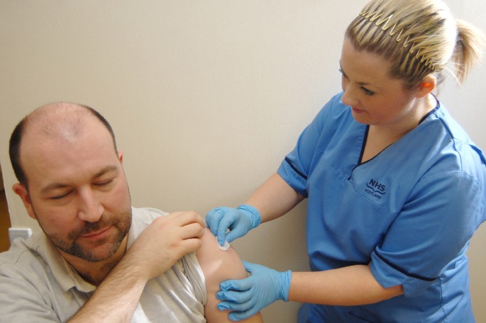 Nurse giving a patient an injection