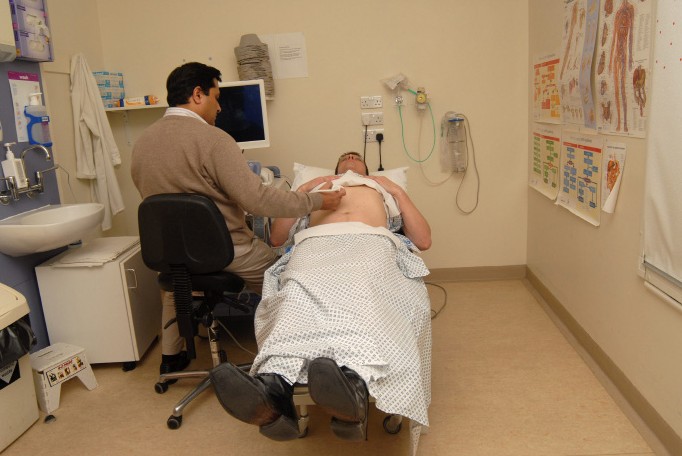 a doctor applying gel to a patient