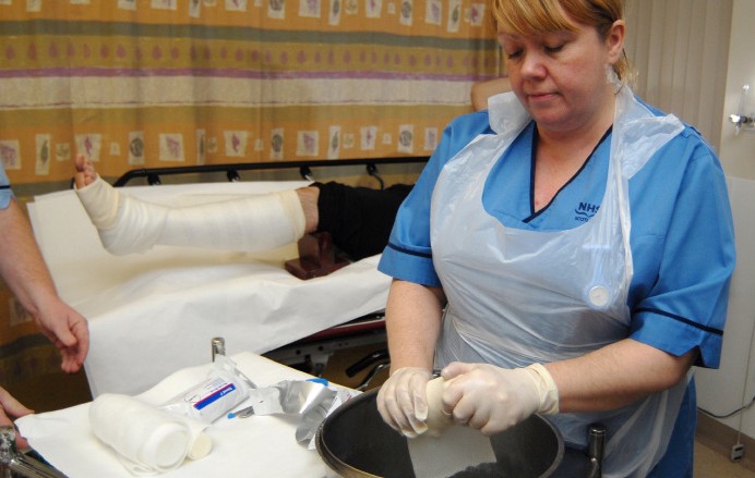 staff preparing bandages