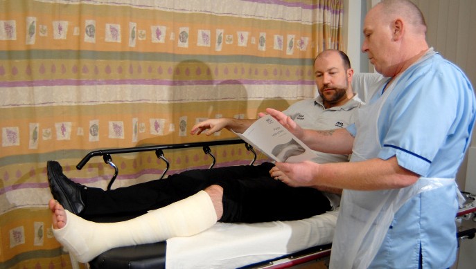 staff talking to a patient