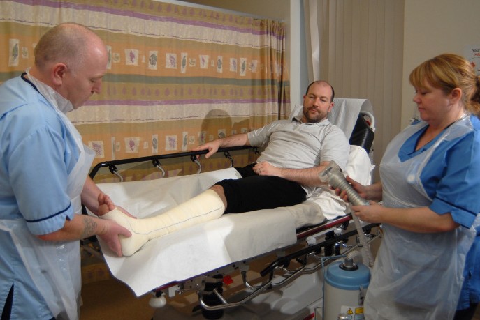 patient with their arm in a cast