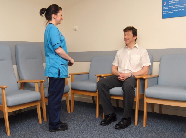 radiographer talking to patient