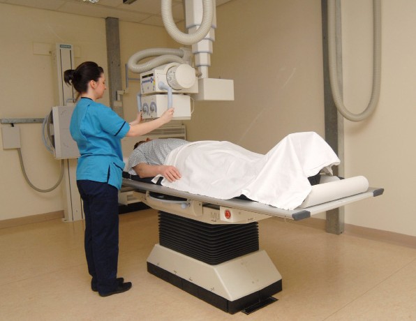 radiographer talking to patient
