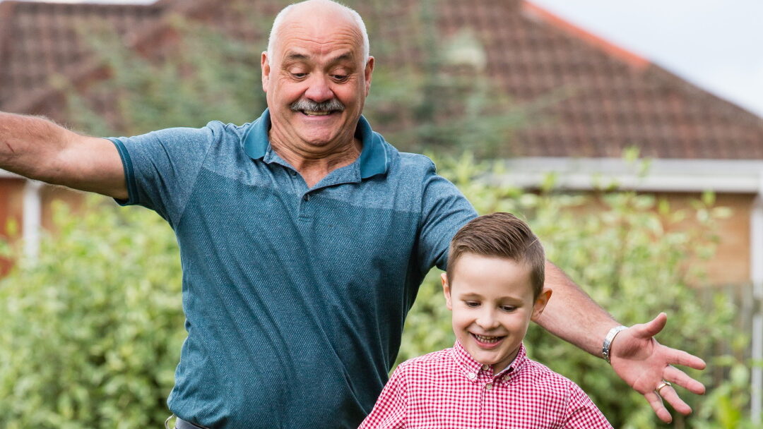Man playing with grandson