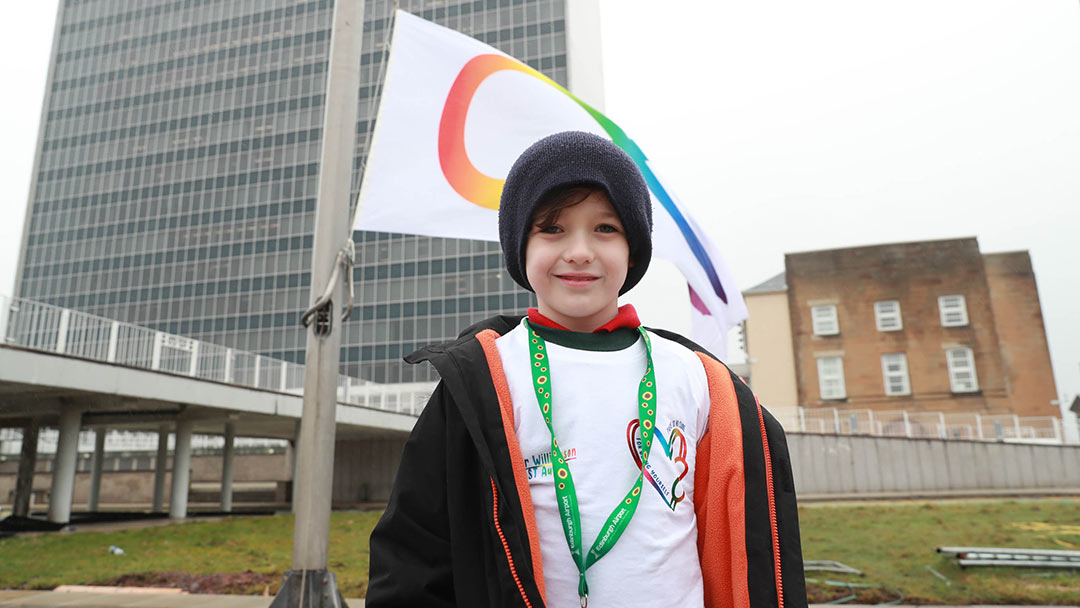 Fraser Williamson (8) from (Hamilton) is living with autism and helped raise the flag. Fraser and his family have been recipients of the supports ARCH provides