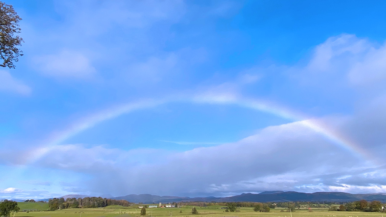 Rainbow in blue sky