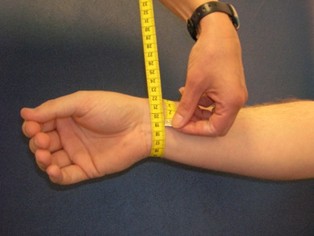 tape measure around a persons wrist