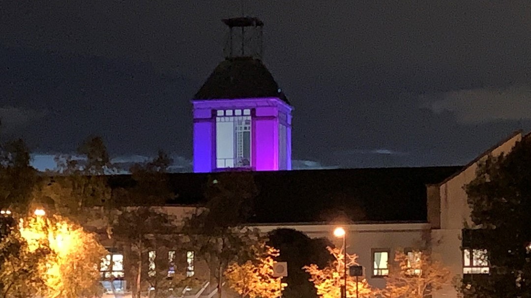 Image of UHW lit up pink and blue