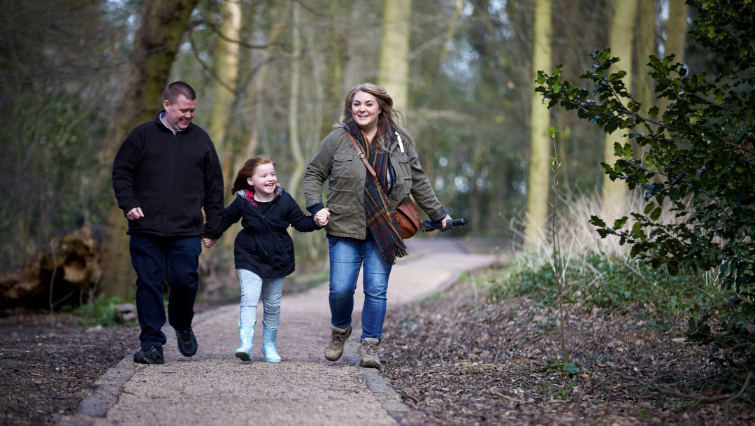 Family walking through the woods