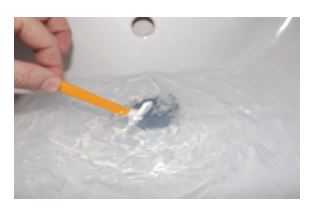 razor being washing in a sink