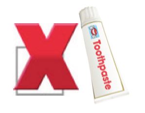 toothpaste next to a red cross