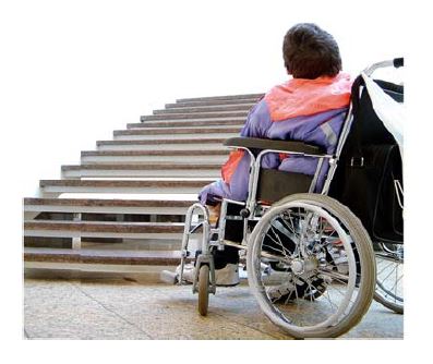 person in a wheelchair looking at stairs