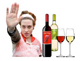 a person indicating stop next to wine