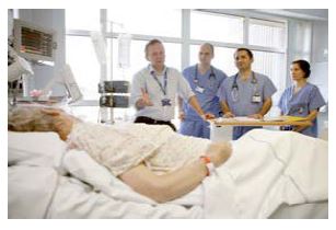 doctors and nurses around a patients bed