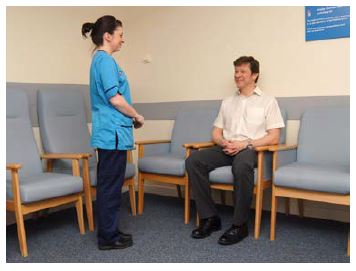 a nurse talking to a patient