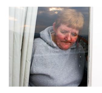 person looking through a glass window