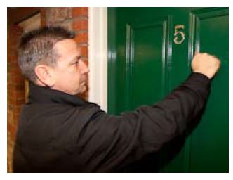 man knocking on a door