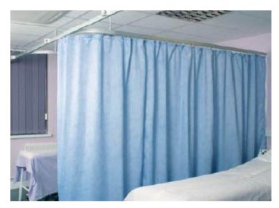 a hospital bed with a curtain around it