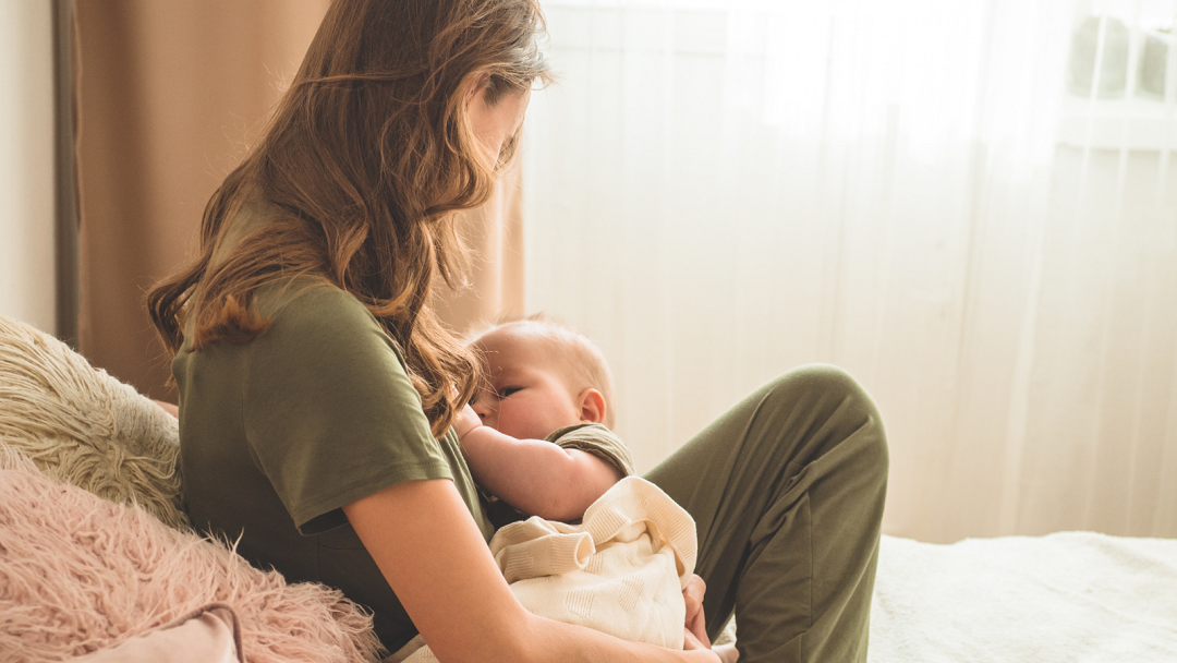 photo of mother breastfeeding her baby