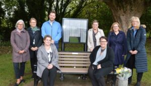 Picture shows a group of people around the new organ donation bench