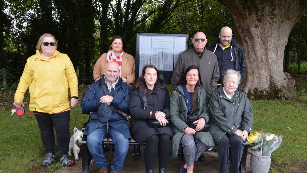 loved ones of those who donated organs sitting on the bench honoring them