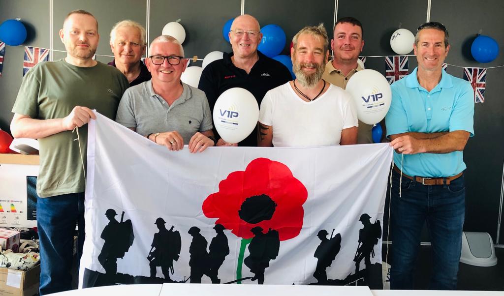 group of men holding flag and balloons