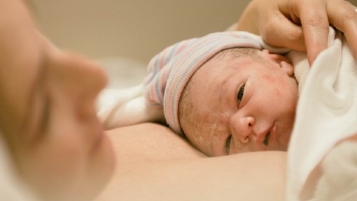 Mother and her newborn baby after giving birth