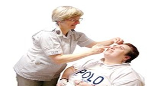 a man having eyedrops put in