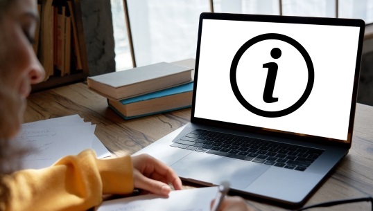 Image of a laptop displaying an information symbol 