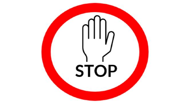 hand raised displaying the word "stop"