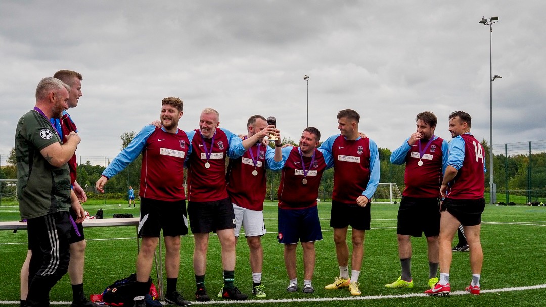 Team representing North Lanarkshire Alcohol Recovery team accepting Recovery Cup trophy